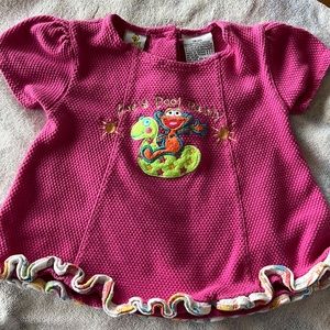 Sesame Street 18 month pink, 2 button in back. Zoe’s Pool Party on font